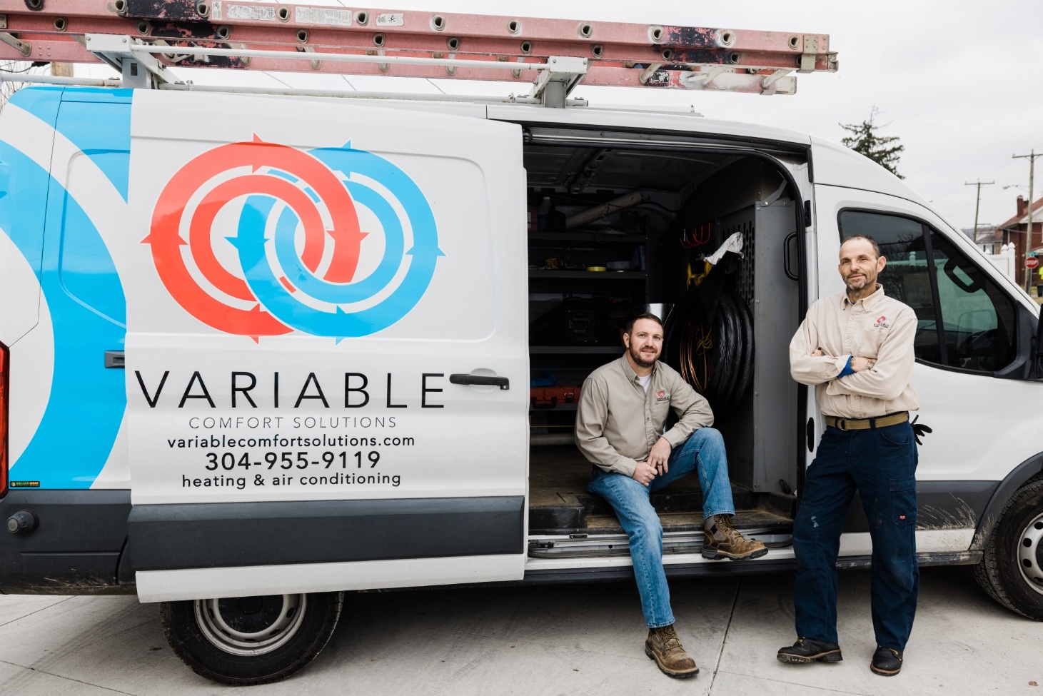 Variable Comfort Solutions employees sitting in branded truck
